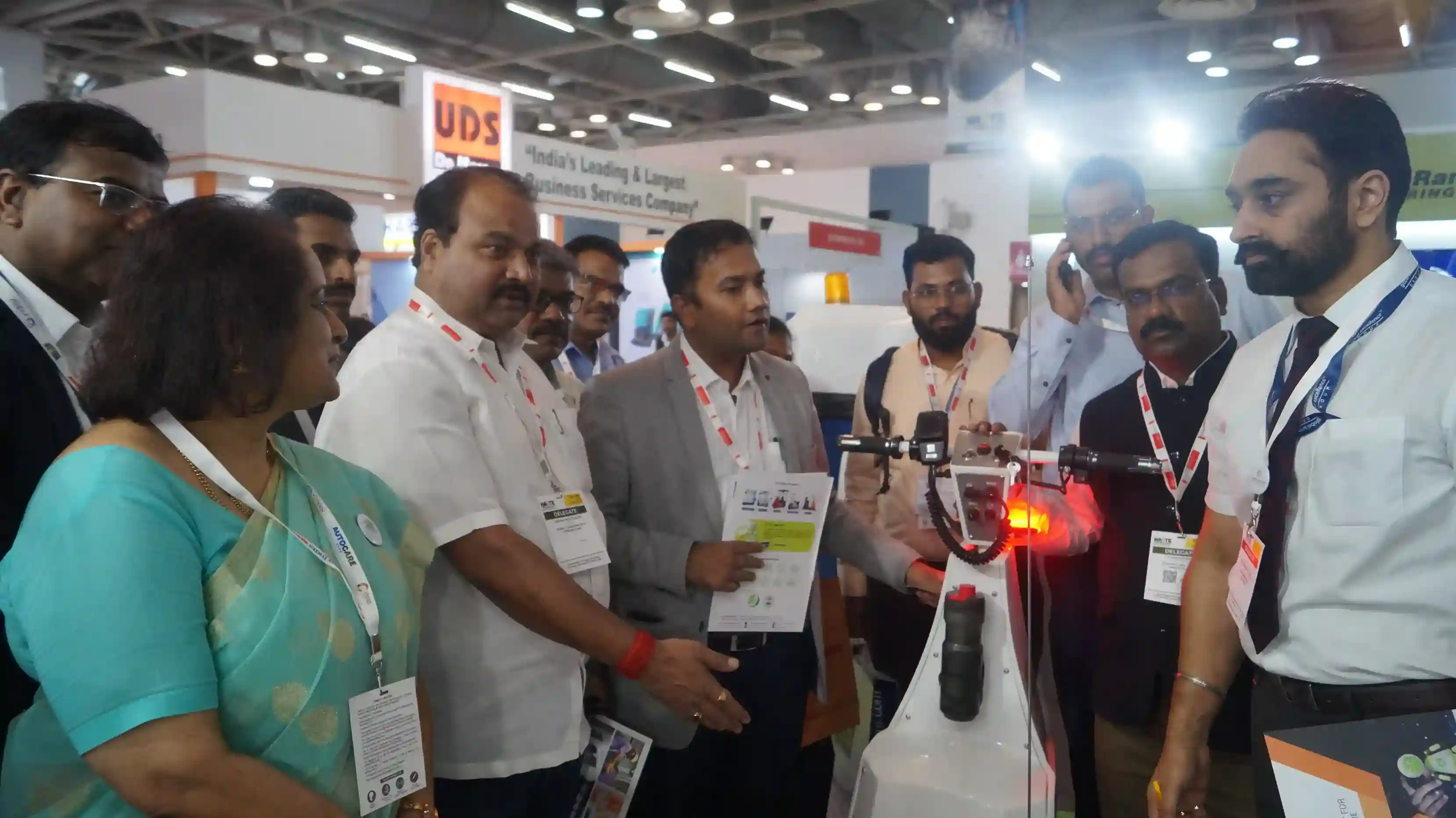 a man explains about the machine to the visitors